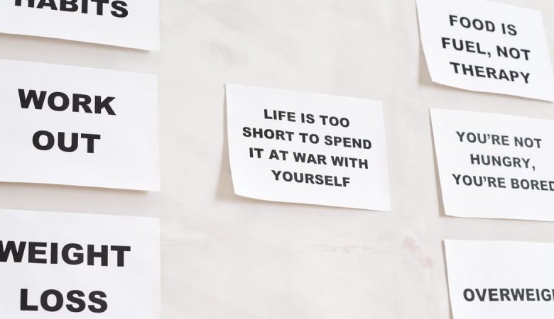 Motivational quotes on white paper promoting healthy habits and lifestyle changes.